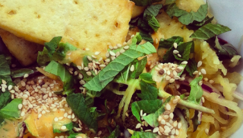 Spaghetti squash noodle bowl with fresh and cooked veg, addictively delicious peanut lime sauce