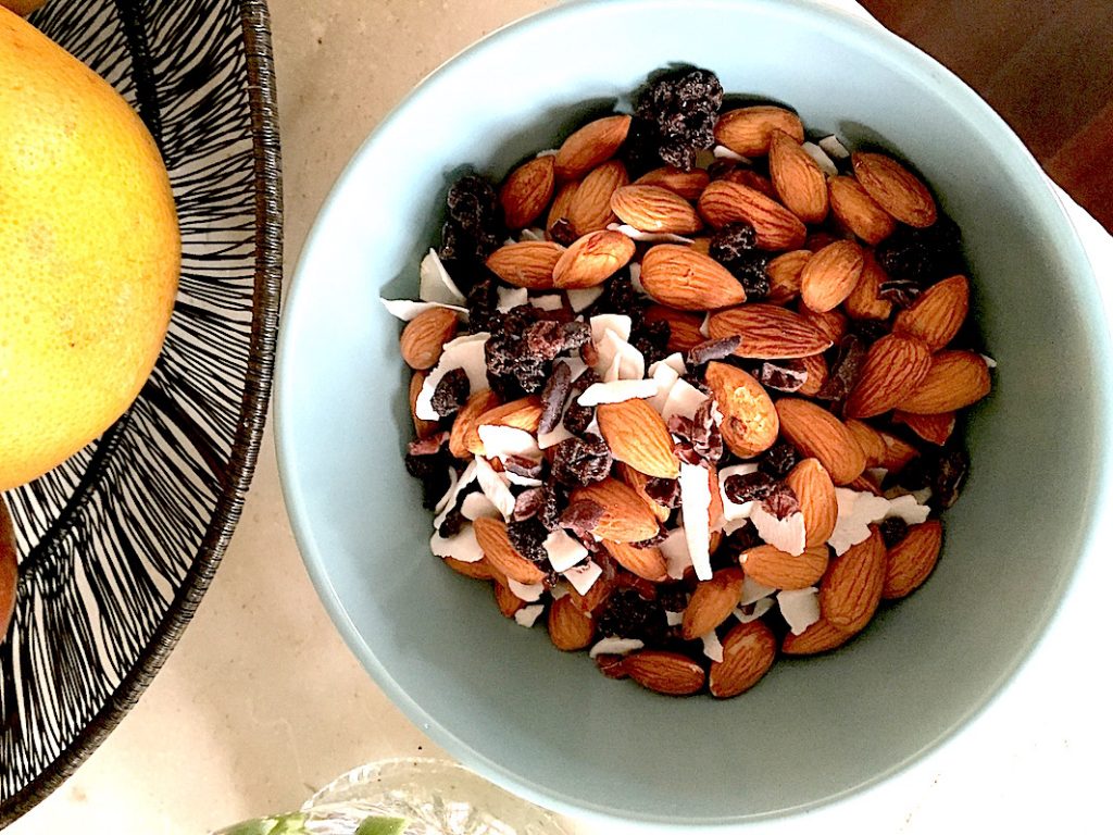 Homemade ageless trail mix with a few of our favorite things: coconut flakes, cacao nibs, and a little sweetness from the currants.
