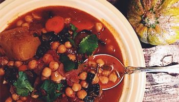 Sweet savory Moroccan winter vegetable stew with chickpeas, dates, butternut squash, and kale 