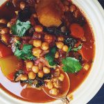 Sweet savory Moroccan winter vegetable stew with chickpeas, dates, butternut squash, and kale 