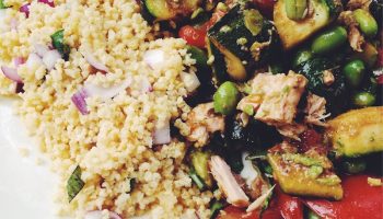Summer version of salad nicoise with grilled zucchini, corn, fresh tomatoes