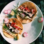 Classic baja fish tacos with cabbage, corn slaw, crema, and homemade pico de gallo
