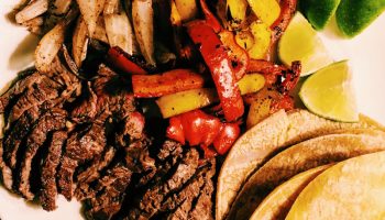Best things about grilled steak fajitas? Grilled vegetables, marinated grass-fed beef, corn tortillas. 