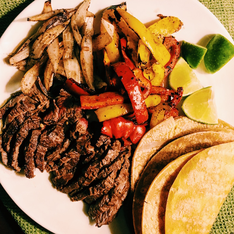 Best things about grilled steak fajitas? Grilled vegetables, marinated grass-fed beef, corn tortillas. 