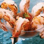 Appetizer: Shrimp with rustic cocktail sauce and lemon slices