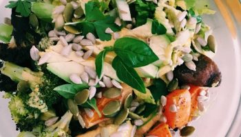 Grain bowl with spicy turmeric dressing, seeds, and fresh herbs is wholesome, filling, and delicious