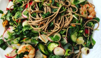 Fresh Herbs, Scallions, and Radishes with a Bright Chile Oil make this noodle salad a success