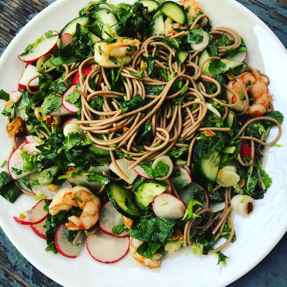 Fresh Herbs, Scallions, and Radishes with a Bright Chile Oil make this noodle salad a success