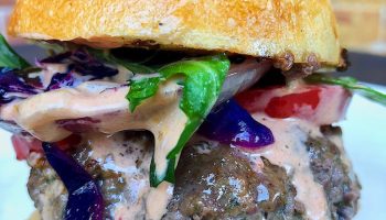 Chimi Burger is juicy, big, and messy like all the best burgers.